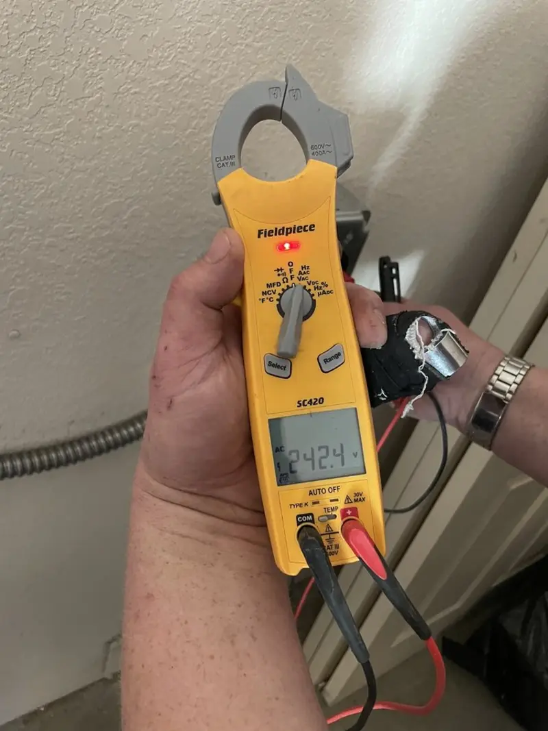 Voltage testing with clamp meter during Electrical Installation Services in Park City